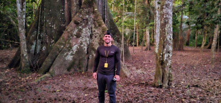 Man standing in front of sacred tree